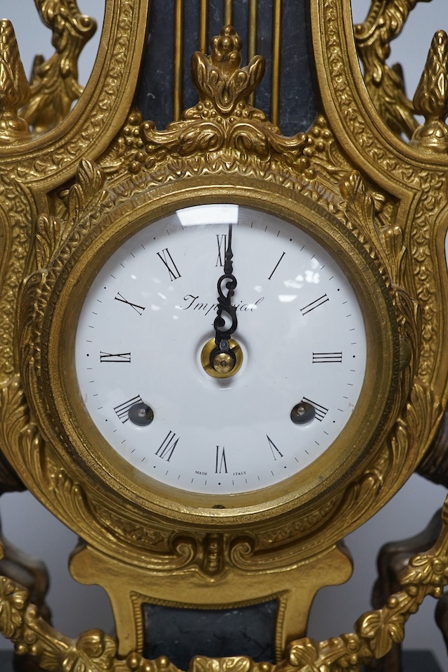 A bronze and marble three piece garniture, key, no pendulum, 69cm. Condition - good, not tested as working